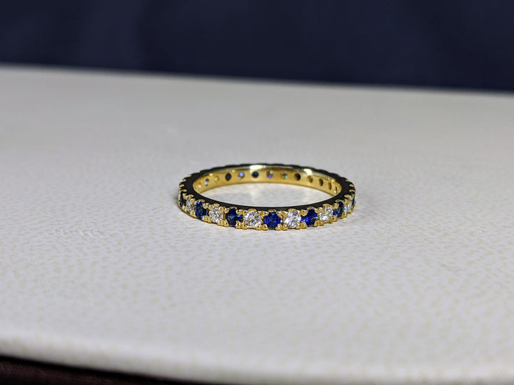 0.75 Ct. Tw. Brilliant Round Cut Diamond & Natural Sapphire Eternity Ring